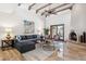 Bright living room with a comfortable sectional sofa, stylish coffee tables, and a decorative fireplace at 9460 N 105Th Pl, Scottsdale, AZ 85258