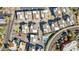 Aerial view of community layout with pool, putting green, roads, and townhomes at 1 Easy St # 15, Carefree, AZ 85377