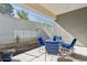 Backyard patio with modern outdoor dining set, rock landscaping, and privacy wall at 1 Easy St # 15, Carefree, AZ 85377