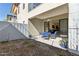 Covered patio with a dining table set, low-maintenance backyard landscaping, and home access via sliding door at 1 Easy St # 15, Carefree, AZ 85377