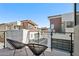 Balcony area offering an amazing view of the neighborhood with comfortable black chairs at 1 Easy St # 15, Carefree, AZ 85377