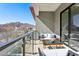 Spacious balcony featuring outdoor seating, mountain views, and glass railings for an unobstructed vista at 1 Easy St # 15, Carefree, AZ 85377