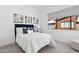 Cozy bedroom featuring a plush bed, stylish art pieces, and a bright window with shade at 1 Easy St # 15, Carefree, AZ 85377