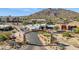 Aerial view of Carefree welcome sign, mountain backdrop, and coffee shop at 1 Easy St # 15, Carefree, AZ 85377