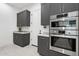 Modern kitchen featuring stainless steel appliances and sleek gray cabinets at 1 Easy St # 15, Carefree, AZ 85377