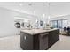 Open-concept kitchen with granite countertops, stainless steel appliances, and tile floors at 1 Easy St # 15, Carefree, AZ 85377