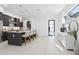 Spacious kitchen featuring a large island with seating, stainless appliances and modern accents at 1 Easy St # 15, Carefree, AZ 85377
