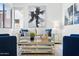 Inviting living room featuring a stylish sofa, blue accents, and a decorative coffee table with mirrored bottom at 1 Easy St # 15, Carefree, AZ 85377