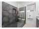 Contemporary shower with hexagonal tile, a built-in shelf, and a sleek glass enclosure at 1 Easy St # 15, Carefree, AZ 85377