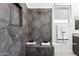 Modern shower with gray tile, built-in bench seating, and glass enclosure at 1 Easy St # 15, Carefree, AZ 85377