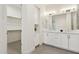 Modern bathroom with double vanity, glass shower, and walk-in closet at 1 Easy St # 4, Carefree, AZ 85377