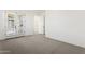 A bedroom with carpet and access to a balcony through a set of glass doors at 1 Easy St # 4, Carefree, AZ 85377
