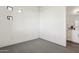 Carpeted bedroom featuring a view to an ensuite bathroom with double vanity and white cabinets at 1 Easy St # 4, Carefree, AZ 85377