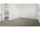 A carpeted bedroom provides a view to an ensuite bathroom with double vanity and white cabinets at 1 Easy St # 4, Carefree, AZ 85377