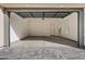 A clean, spacious two-car garage with epoxy floors, and paneled door at 1 Easy St # 4, Carefree, AZ 85377