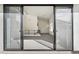 View from the balcony featuring carpeted interior and modern railing through sliding glass door at 1 Easy St # 4, Carefree, AZ 85377