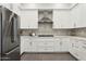 Modern kitchen featuring white cabinets, stainless steel appliances, and a stylish backsplash for a gourmet experience at 1 Easy St # 4, Carefree, AZ 85377