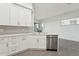 Bright kitchen with white cabinets, stainless steel appliances, undermount sink, and neutral backsplash at 1 Easy St # 4, Carefree, AZ 85377