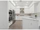 Modern kitchen with white cabinetry, stainless steel appliances, and a stylish island, perfect for cooking at 1 Easy St # 4, Carefree, AZ 85377