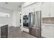 Modern kitchen featuring stainless steel appliances, sleek white cabinetry, and a stylish tile backsplash at 1 Easy St # 4, Carefree, AZ 85377