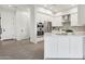 Bright kitchen with white cabinetry, stainless steel appliances, and an inviting island in an open layout at 1 Easy St # 4, Carefree, AZ 85377