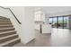 Bright, open-concept living space with modern tile flooring, leading to a white kitchen and outdoor patio at 1 Easy St # 4, Carefree, AZ 85377