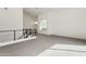 Sunlit loft showcasing neutral carpet, high ceilings, modern black railing, and recessed lighting at 1 Easy St # 4, Carefree, AZ 85377
