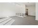 Bright open loft with carpeted flooring, high ceilings, modern railing, and recessed lighting at 1 Easy St # 4, Carefree, AZ 85377