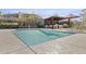 A community pool with desert landscaping and outdoor lounge furniture at 1 Easy St # 4, Carefree, AZ 85377