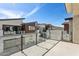 Balcony view with glass railing and neighboring brown and beige buildings under clear skies at 1 Easy St # 5, Carefree, AZ 85377