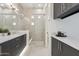 Bright bathroom featuring a glass shower, double vanity, and modern fixtures in a luxurious setting at 1 Easy St # 5, Carefree, AZ 85377