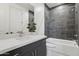 Modern bathroom featuring sleek fixtures, a quartz countertop, and a combination tub and shower at 1 Easy St # 5, Carefree, AZ 85377