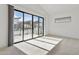 Bright bedroom featuring a large sliding glass door leading to an outdoor balcony with mountain views at 1 Easy St # 5, Carefree, AZ 85377