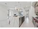 Bright, modern kitchen with a large island, stainless steel appliances, and an open layout into the living area at 1 Easy St # 5, Carefree, AZ 85377