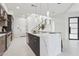 Contemporary kitchen with a large island, stainless steel appliances, and an open staircase design at 1 Easy St # 5, Carefree, AZ 85377