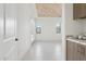 Bright living room with tile floors and wood plank ceiling, adjacent to coffee bar at 1 Easy St # 5, Carefree, AZ 85377