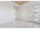 Bright living room featuring tiled floors and access to outdoor space through double doors at 1 Easy St # 5, Carefree, AZ 85377
