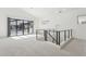 Bright upstairs loft area featuring neutral carpet and access to outdoor balcony at 1 Easy St # 5, Carefree, AZ 85377