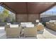 Relaxing outdoor lounge area with comfortable seating, a grill, and shade from the sun at 1 Easy St # 5, Carefree, AZ 85377