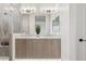 Main bathroom with double sink vanity, tiled shower, and decorative lighting at 1 Easy St # 5, Carefree, AZ 85377