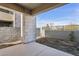 Concrete patio area and exterior block wall features minimal landscaping and a view of the community at 1 Easy St # 5, Carefree, AZ 85377