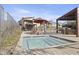 A community pool and spa with lounge seating areas and modern buildings in the background at 1 Easy St # 5, Carefree, AZ 85377