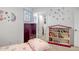 Charming bedroom with colorful decor, storage options, and a bright window at 10101 N Arabian Trl # 1005, Scottsdale, AZ 85258
