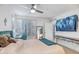 Comfortable bedroom with shutters, mirror and desk with chair in a naturally lit space at 10101 N Arabian Trl # 1005, Scottsdale, AZ 85258