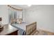 Comfortable bedroom with shuttered windows, natural wood bed frame, and soft decor at 10101 N Arabian Trl # 1005, Scottsdale, AZ 85258