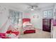 Bright bedroom with a cozy teepee, accent wall decorations, and plush decor at 10101 N Arabian Trl # 1005, Scottsdale, AZ 85258