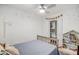 Bright bedroom with walk-in closet, ceiling fan, and cute built-in bookshelf at 10101 N Arabian Trl # 1005, Scottsdale, AZ 85258
