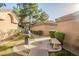 The private courtyard has a built-in barbecue grill and park bench for easy outdoor living at 10101 N Arabian Trl # 1005, Scottsdale, AZ 85258