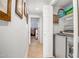 Well-lit hallway leading to laundry area and other rooms, showcasing a clean design at 10101 N Arabian Trl # 1005, Scottsdale, AZ 85258