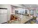 The open-concept kitchen offers bar seating, stainless appliances, and granite countertops at 10101 N Arabian Trl # 1005, Scottsdale, AZ 85258